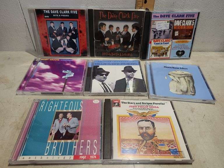8 Assorted Cds, The Righteous Brothers, Sousa, Cat Stevens, Blues Brothers, Moby Grape, & Dave Clark