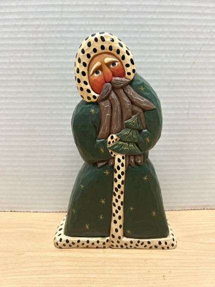 Carved Wooden Santa Figure Featuring Green Robe and Star Details
