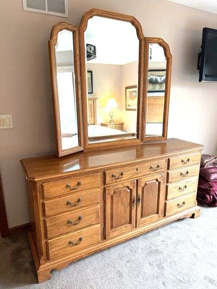 Thomasville low oak dresser with hinged mirror