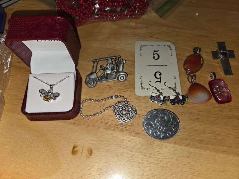 Several earrings and necklace pendants