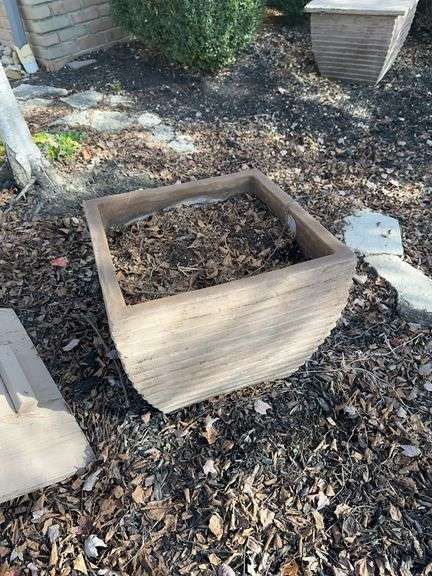 Three large concrete planters