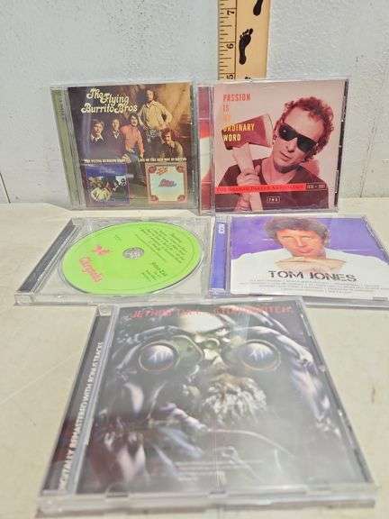6 Assorted Cds, Raven, Graham Parker, Roy Woods, Tom Jones, & Jethro Tull