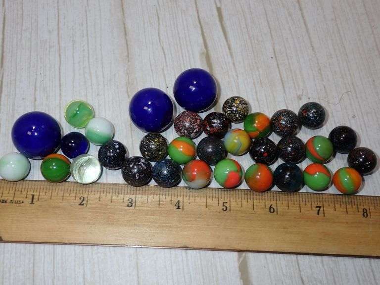 33 Glass Swirl Marbles in blacks, Yellow and Blue Tones