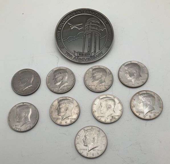 Nine Kennedy Half Dollars and a Port Columbus Commemorative Coin