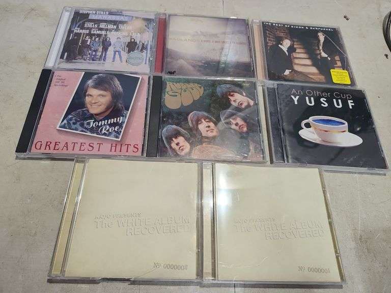 8 Assorted Cds, Stephen Stills, Badlands, Simon & Garfunkel, Tommy Roe, The Beatles, Yusuf, & Mojo