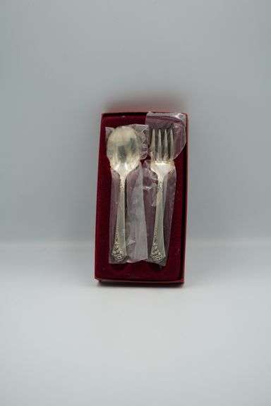Two Distinct Sets of Decorative Flatware