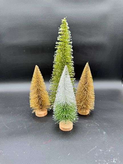 Four Bottle Brush Christmas Trees in Various Colors