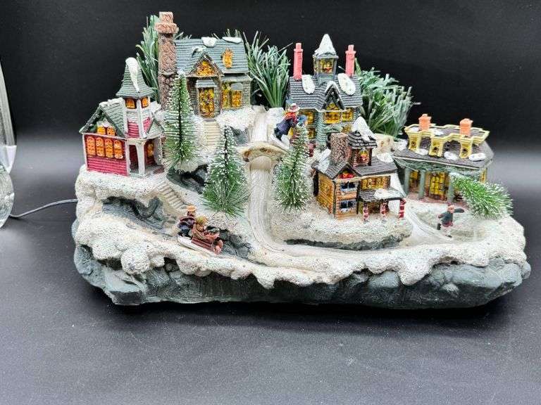 Illuminated Christmas Village With Winter Scene