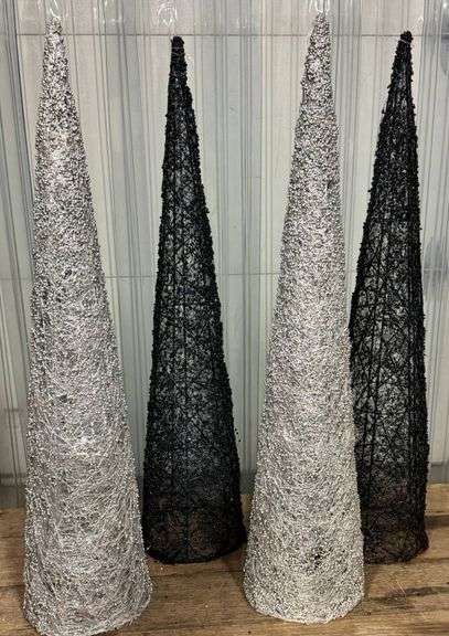 Four Silver and Black Decorative Cone Figures