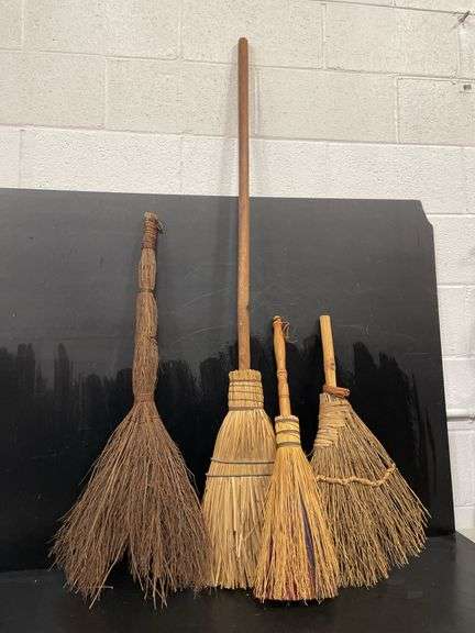 Four handmade brooms