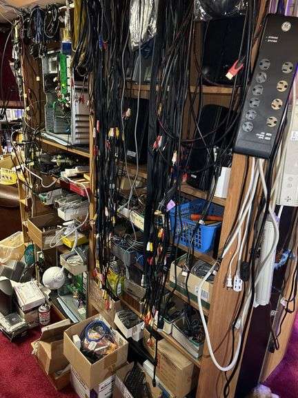 Contents of Shelf (shelf excluded) Computer Speakers, Batteries, RCA Cables, etc.