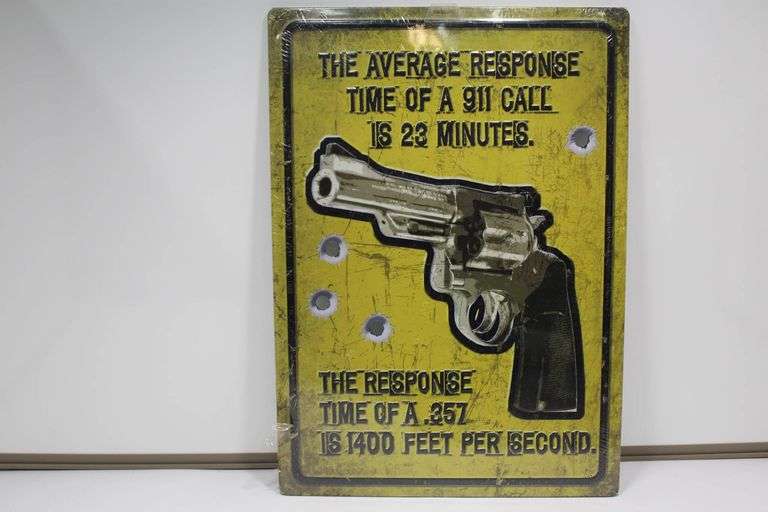 Set of Two Metal Signs Featuring Gun Themes