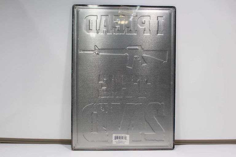 Set of Two Metal Signs Featuring Gun Themes