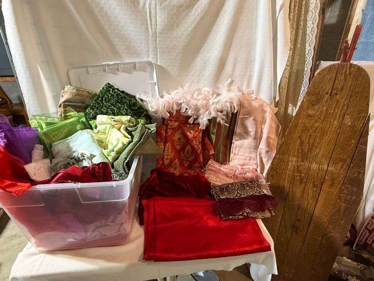 Tote Filled With Fabric And Old Wood Ironing Board