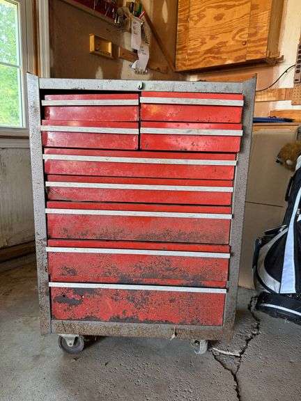 Red Metal Tool Chest with Multiple Drawers and Contents