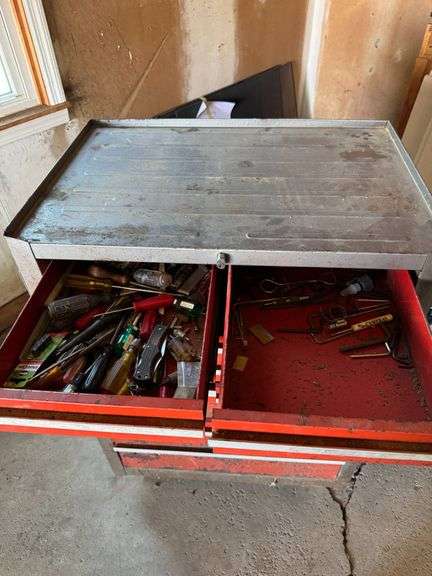 Red Metal Tool Chest with Multiple Drawers and Contents
