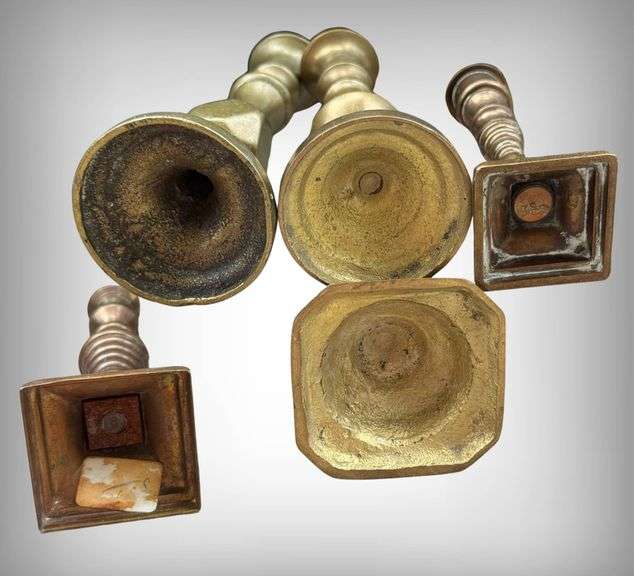 Five Demure Brass Candlesticks with Varied Designs