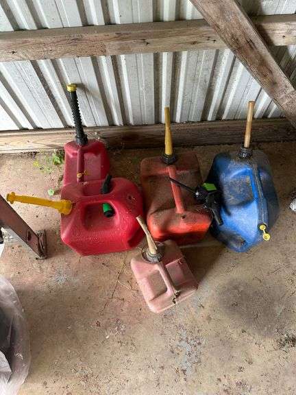 Four Plastic Fuel Containers in Red and Blue with Spouts