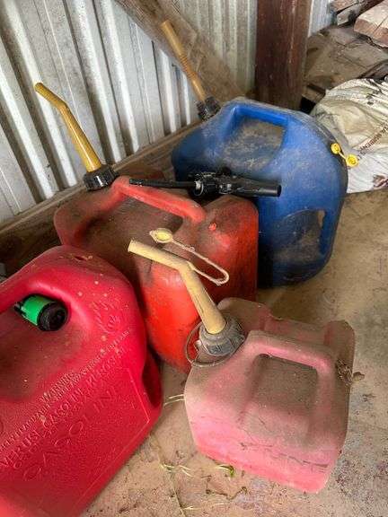 Four Plastic Fuel Containers in Red and Blue with Spouts