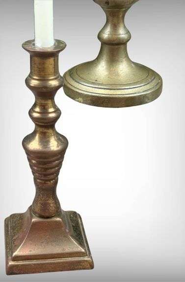 Five Demure Brass Candlesticks with Varied Designs