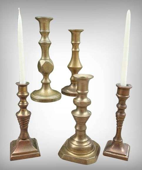 Five Demure Brass Candlesticks with Varied Designs