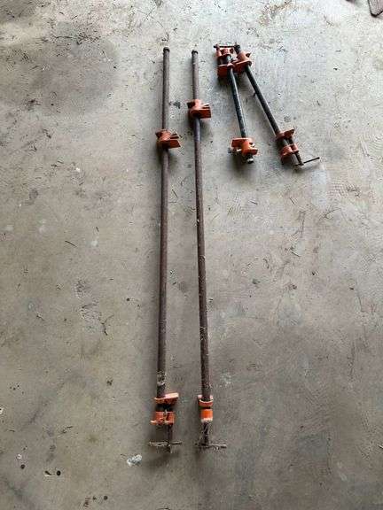 Four Steel Bar Clamps with Orange Cast Iron Fixtures