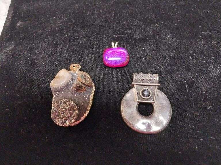 Striking art deco-inspired pendant along with Two more Pendants.