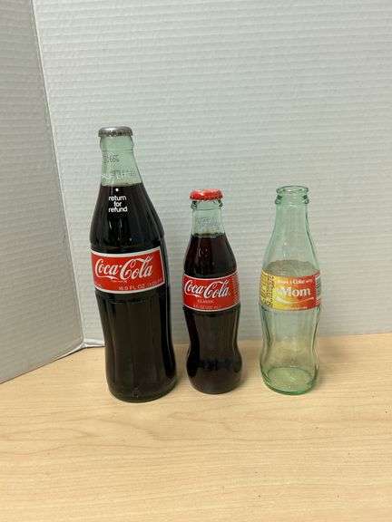 Trio of Coca-Cola Bottles – Two Full, One Empty