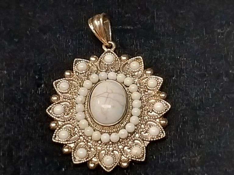 Gold-Toned Filigree Pendant with White Cabochon