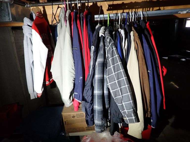 Collection of outerwear jackets in basement
