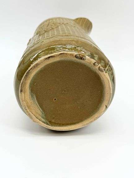 Brown Ceramic Pitcher with Grape Motif and Textured Design