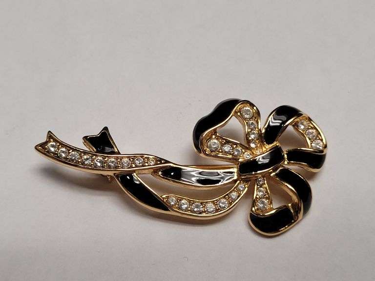 Gold-Tone Bow Brooch with Black Enamel and RhinestonesVintage MONET® Gold-Tone Rose Brooch