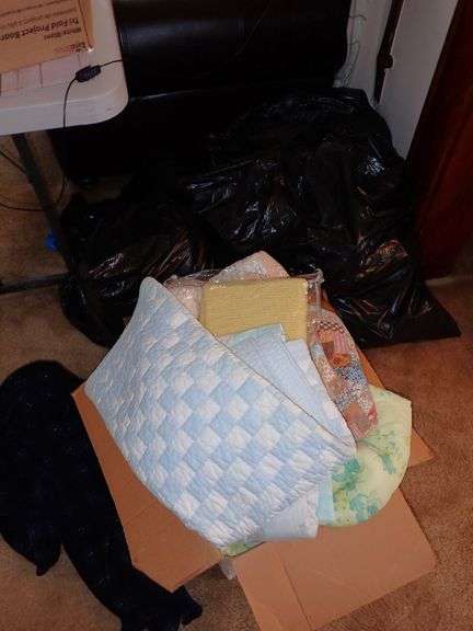 1 box & 3 bags filled with clean unsearched clothing & blankets