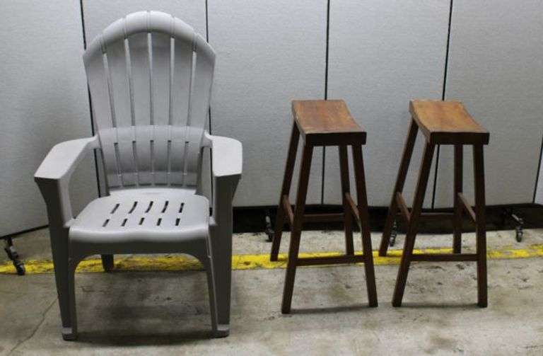 Gray Plastic Adirondack Chair and Two Wooden Bar Stools