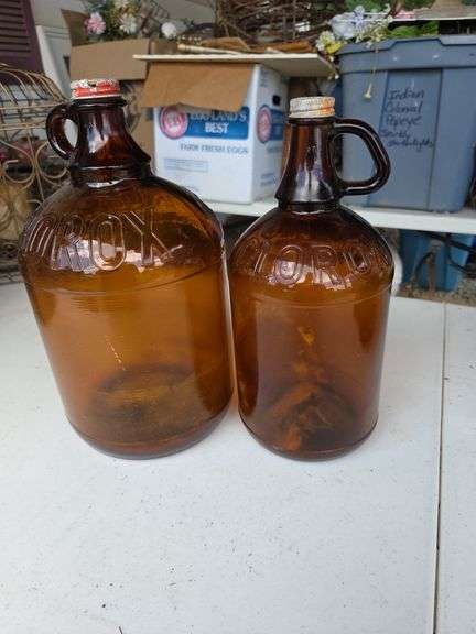 2 Large brown Clorox bottles