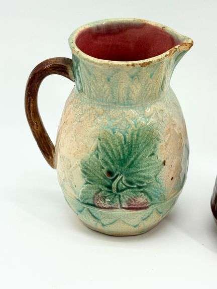 Two Victorian Majolica Cream Pitchers with Floral and Botanical Designs