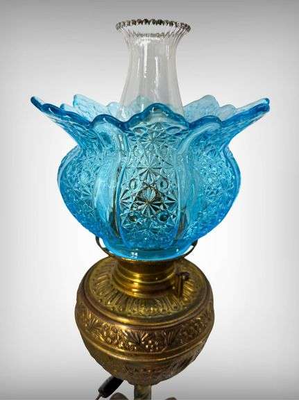 Antique Brass Victorian-Style Oil Lamp with Blue Daisy and Button Glass Shade and Wrought Iron Base
