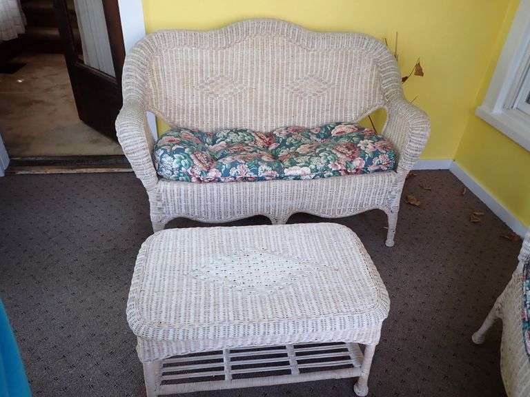 Real Wicker Loveseat & Coffee table.  Stored inside sunroom.  Solid and complete