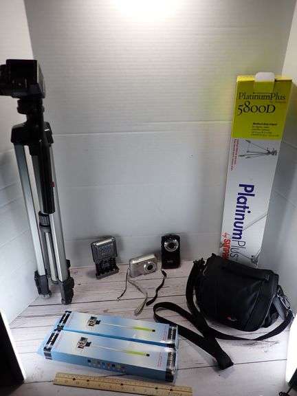 2 Tripods (no shoe) 2 Selfie Sticks 2 untested Cameras, Camera Bag & Energizer AA Battery Charger