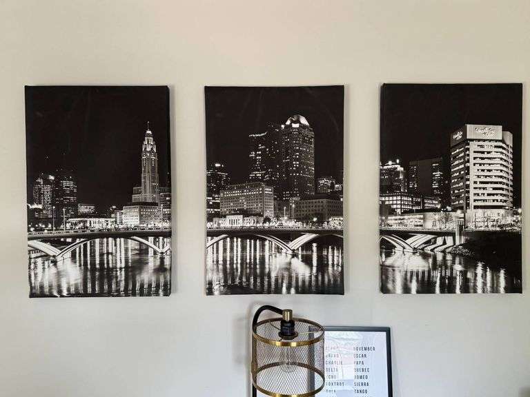 Three Black-and-White Canvas Prints Featuring Urban Skyline at Night