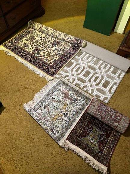 Four Patterned Area Rugs with Fringe