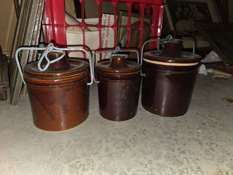 3 brown canisters with lids