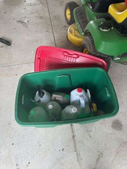 Plastic Jugs and Containers in a Green Storage Bin