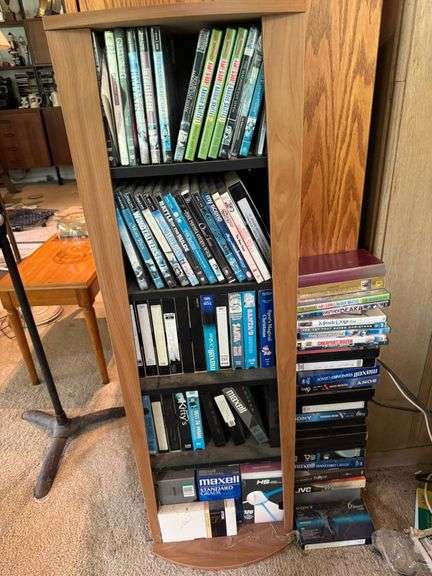 Wooden Media Shelf With DVDs, VHS Tapes, and VHS Cases