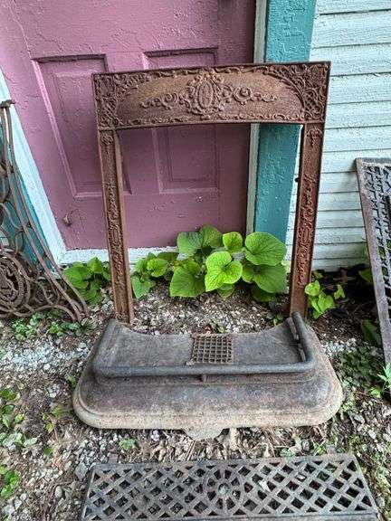 Antique Cast Iron Fireplace Surround with Ornate Relief Design
