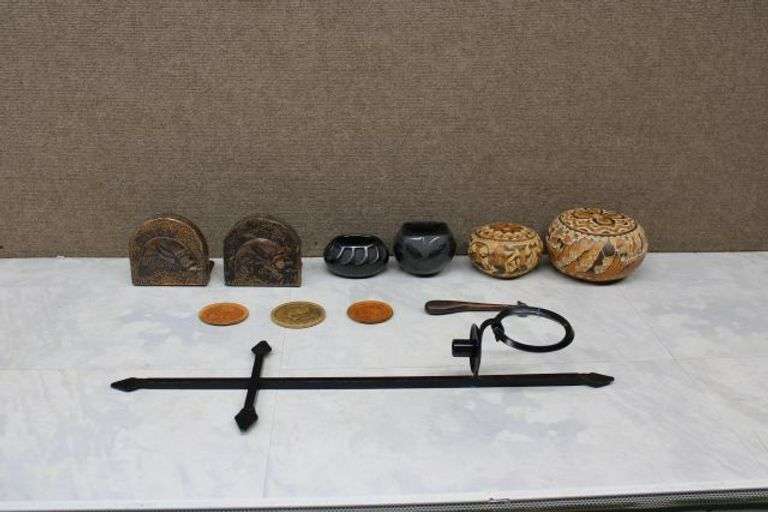 Decorative Items Including Pottery, Bookends, Wall Sconce, and Carved Coasters