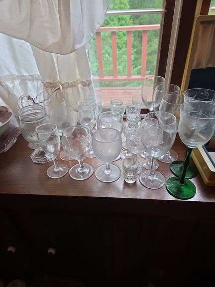 Large lot of clear wine glasses