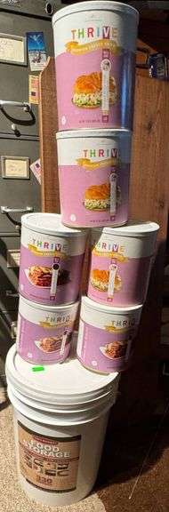 Stacked Emergency Food Storage Buckets and Cans by Thrive Life and Chef’s Banquet