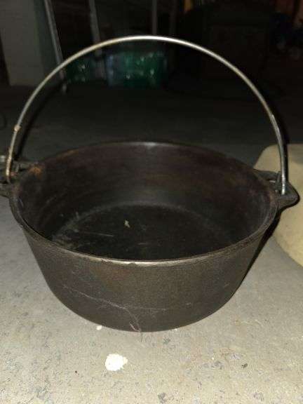 Large cast iron pot with handle