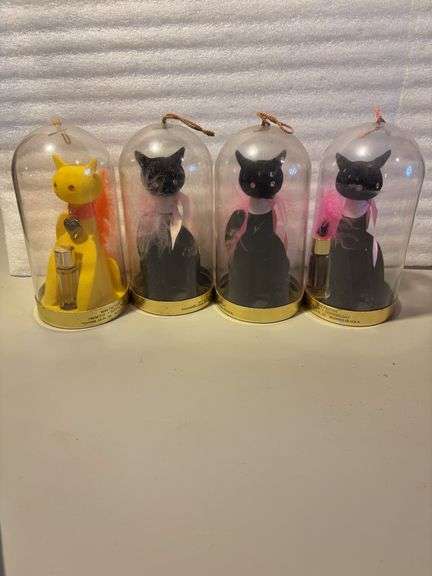 3 black and 1 yellow perfume sets